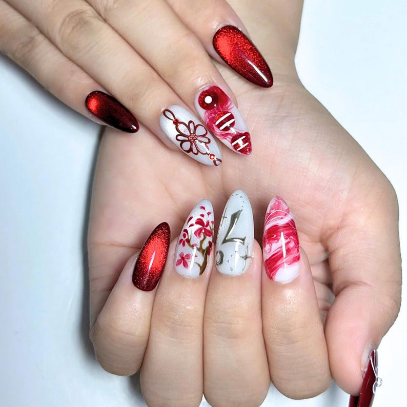 Handmade K-pop concert inspired press on nails featuring burgundy chrome gradients, glossy marble nail art, elegant floral details, concertcore aesthetic, and luxury reusable gel nails perfect for concerts, fan meetings, and music festivals.