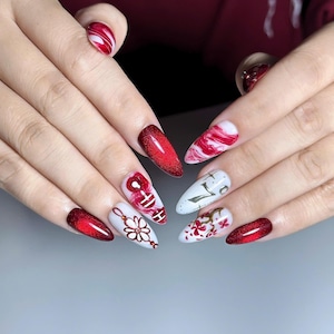 Handmade K-pop concert inspired press on nails featuring burgundy chrome gradients, glossy marble nail art, elegant floral details, concertcore aesthetic, and luxury reusable gel nails perfect for concerts, fan meetings, and music festivals.