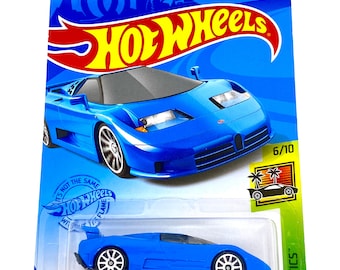 May include: A blue 1994 Bugatti EB110 SS Hot Wheels die-cast car in a blue and green package. The car is a 6/10 in the Hot Wheels Exotics series. The package has the Hot Wheels logo and the text "It's not the same without Hot Wheels Flame".