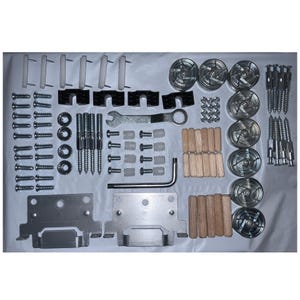 May include: A collection of furniture hardware components, including screws, bolts, dowels, and metal brackets. The assortment features various sizes and shapes, with a wrench and other tools visible. The items are arranged on a white surface.