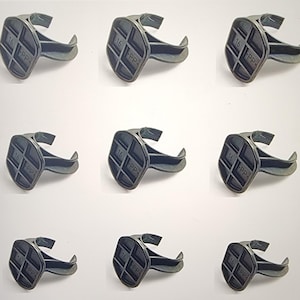 May include: Nine dark gray plastic clips. Each clip has a hexagonal head with the number "16" and the letters "PP" embossed on it. The clips have a curved, hook-like design.