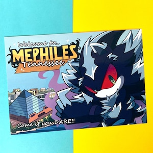 May include: Postcard featuring a stylized illustration of a dark, spiky character with red eyes and white accents. The postcard reads "Welcome to MEPHILES Tennessee" with a pyramid and the phrase "Come if you DARE!!" on a blue and yellow background.