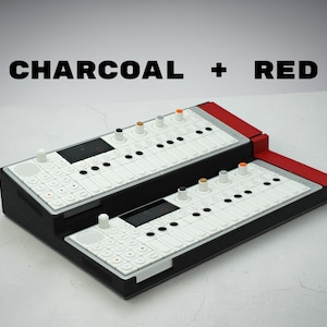 May include: Two electronic music synthesizers, one stacked on top of the other, in charcoal and red. The top synthesizer has a red accent, while the bottom one is charcoal. Both have white keys and various colored knobs. The text "CHARCOAL + RED" is above the synthesizers.