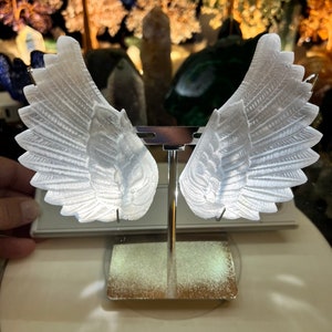 Selenite crystal angel wings with excellent detail.  Stand is included, choice of gold or silver.