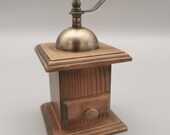 Pepper mill in the form of a coffee grinder used