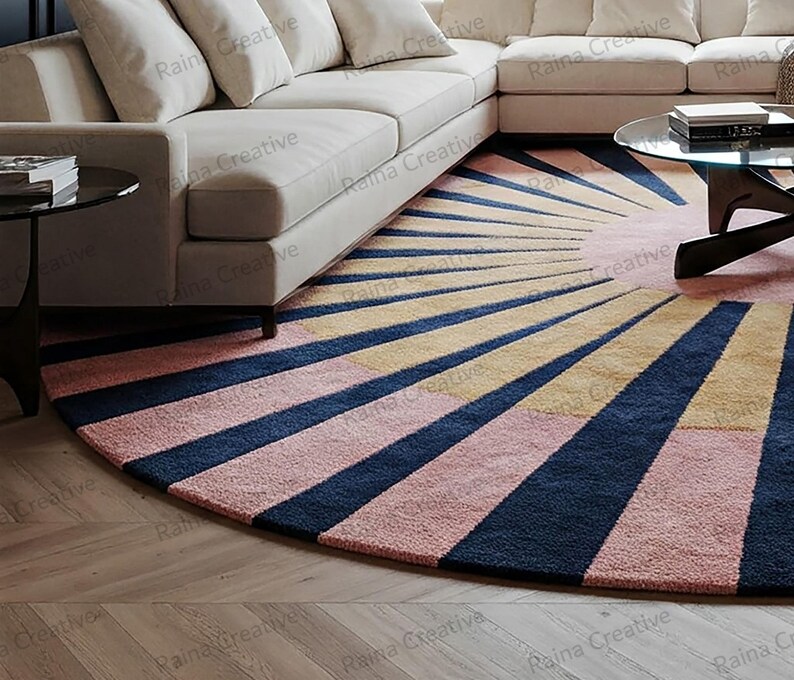 Round sunburst rug in navy, mustard, and pink; hand-tufted wool blend, 9ft, modern boho living room carpet.