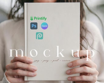 May include: A white book mockup with the text "MOCKUP" and the words "jpg, png, psd, canva" written below. The book has logos for Printify, Canva, Photoshop, and a generic design app logo.