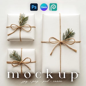 May include: Three white gift boxes, wrapped and tied with twine, adorned with evergreen sprigs. The word "mockup" is displayed below the gifts, along with file type extensions. The image also includes the logos for Photoshop, Canva, and Photopea.