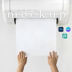 May include: A white printer with the word "mockup" printed on it, with a blank white paper coming out of the printer. The image also includes the logos for Photoshop, Canva, and PicMonkey.