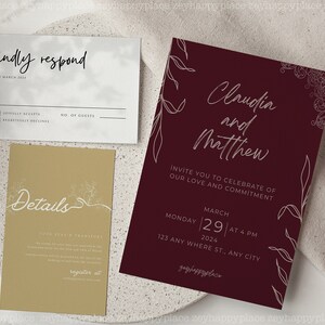 K&ouml;nnte beinhalten: Eine burgunderrote Hochzeitseinladung mit wei&szlig;en floralen Illustrationen und dem Text "Claudia und Matthew" und "Invite you to celebrate of our love and commitment". Die Einladung enth&auml;lt auch das Datum und die Uhrzeit der Hochzeit: "Montag, 29. M&auml;rz 2024 um 16:00 Uhr".