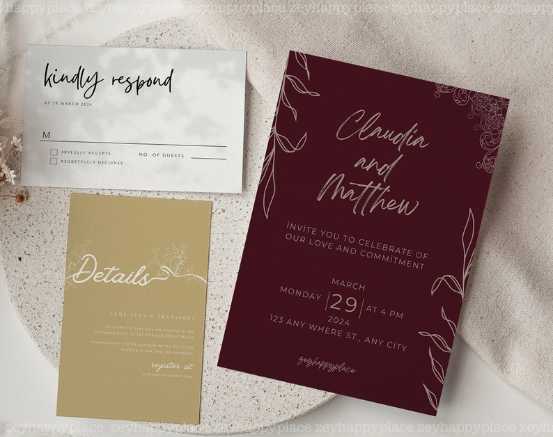 K&ouml;nnte beinhalten: Eine burgunderrote Hochzeitseinladung mit wei&szlig;en floralen Illustrationen und dem Text "Claudia und Matthew" und "Invite you to celebrate of our love and commitment". Die Einladung enth&auml;lt auch das Datum und die Uhrzeit der Hochzeit: "Montag, 29. M&auml;rz 2024 um 16:00 Uhr".