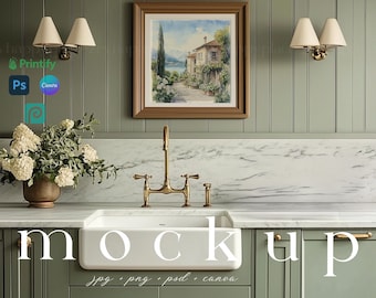 May include: A white farmhouse style kitchen sink with a gold faucet and a marble countertop. The backsplash is green wood paneling with a framed watercolor painting of a house and a lake. The cabinets are green with gold hardware.