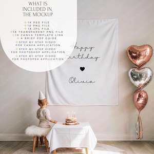 May include: A white backdrop with the text "Happy Birthday Olivia" and a heart symbol. The image includes heart-shaped balloons and a small cake with candles. A child wearing a party hat stands near the cake.