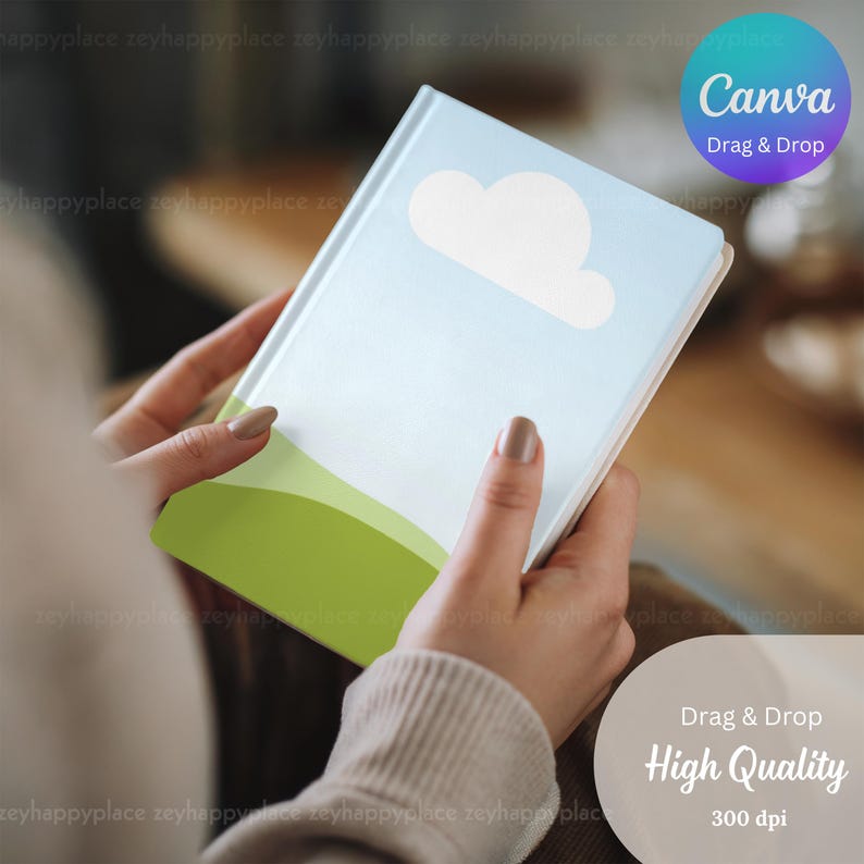 May include: A light blue notebook with a white cloud and green hills on the cover. The notebook is being held by a person's hands. The text "Canva Drag & Drop" is visible in the upper right corner of the image. The text "Drag & Drop High Quality 300 dpi" is visible in the lower right corner of the image.