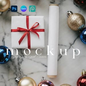 May include: A white gift box tied with a red ribbon, a rolled-up white paper tube, and various Christmas ornaments. The word "mockup" is displayed in the image. The image also includes the logos for Photoshop, Canva, and Pinterest.