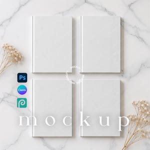 May include: Four blank white rectangular books arranged in a two-by-two grid. The books have a clean, solid white cover. Small icons for Photoshop, Canva, and Procreate are visible on the left side, along with the text mockup.