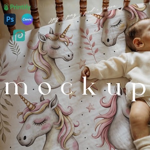 May include: A white baby crib sheet featuring a whimsical unicorn design with pink and yellow manes and closed eyes. The sheet has a repeating pattern of unicorns, stars, and leaves. The word "mockup" is printed on the sheet.