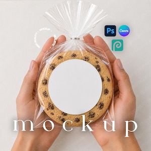 May include: A chocolate chip cookie with a white label is packaged in a clear cellophane bag. The bag is tied with a silver twist tie. The word "mockup" is printed at the bottom of the image.
