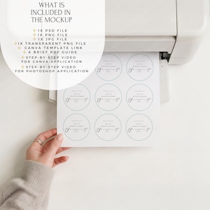 May include: A printer is shown with a sheet of round stickers being printed. The stickers have a light blue border and text that reads "Ashley & Dave". The text "WHAT IS INCLUDED IN THE MOCKUP" is at the top left, listing file types and video guides.