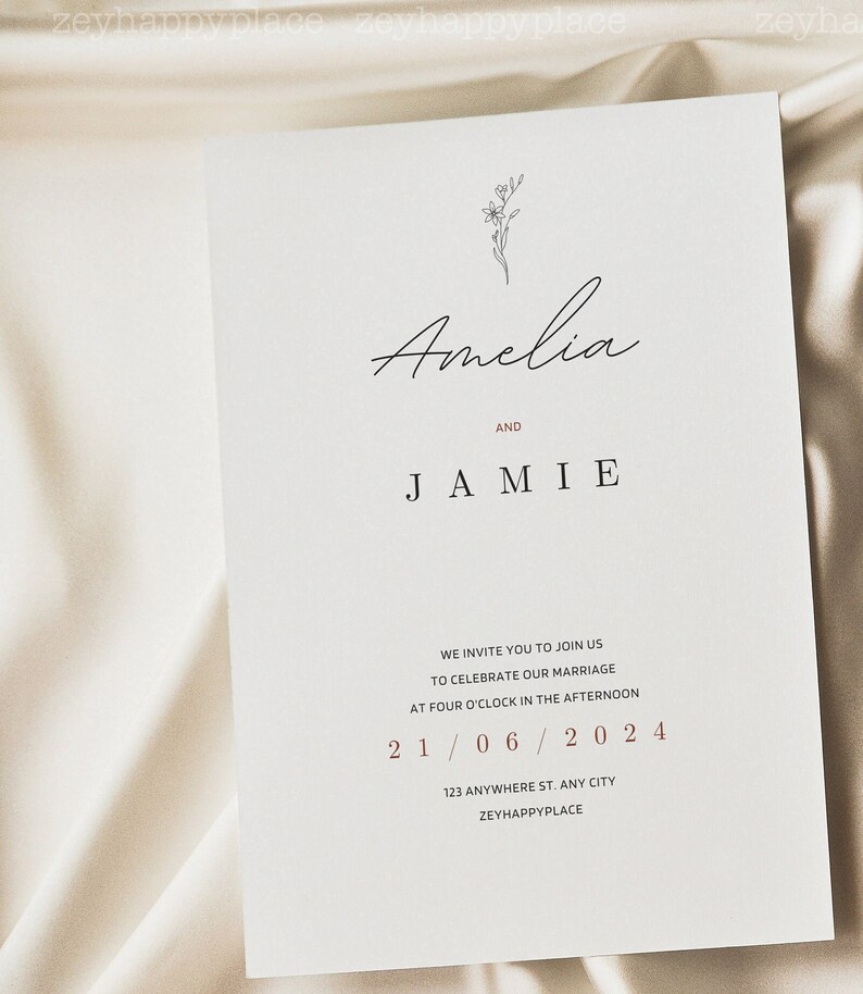 May include: A minimalist wedding invitation with a simple floral illustration. The invitation reads "Amelia and Jamie" with the wedding date "21/06/2024" and the address "123 Anywhere St. Any City, Zeyhappyplace".