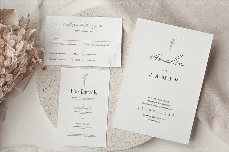 K&ouml;nnte beinhalten: Eine Hochzeitseinladungssuite im minimalistischen Design. Die Einladung zeigt die Namen Amelia und Jamie in Kursivschrift mit einer kleinen floralen Illustration. Die Detailkarte enth&auml;lt das Datum, die Uhrzeit und den Ort der Hochzeit. Die RSVP-Karte enth&auml;lt einen Abschnitt, in dem die G&auml;ste ihre Essensvorlieben angeben k&ouml;nnen.