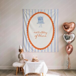 May include: A birthday banner with blue and white stripes and an orange scalloped border. The banner has a cake illustration and the text "2nd birthday of Olivia". Three heart-shaped balloons are to the right.