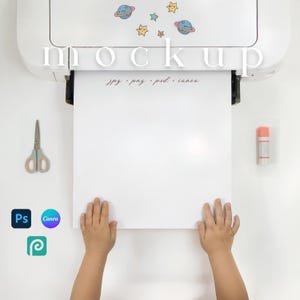 May include: A white mockup template with the word "mockup" in a serif font. The template is held by two hands. The image includes a pair of scissors, a glue stick, and icons for Photoshop, Canva, and Procreate. The text "jpg, png, psd, canva" is also visible.