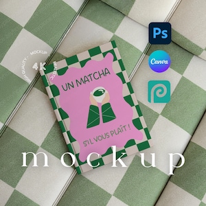 May include: A mock-up book cover with the text "UN MATCHA S'IL VOUS PLAÎT!" in a pink and green design. The book is on a green and white checkered surface. The image also includes icons for Photoshop, Canva, and Picsart.