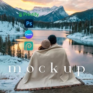 May include: A scenic outdoor mockup featuring a couple wrapped in a cream-colored blanket, with the word "mockup" overlaid. The background showcases a lake, mountains, and logos for Printify, Photoshop, Canva, and Placeit.