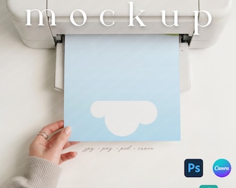 May include: A light blue paper with a white cloud design is being printed from a white printer. The word "mockup" is printed at the top. The bottom of the paper has the text "jpg . png . psd . canva".
