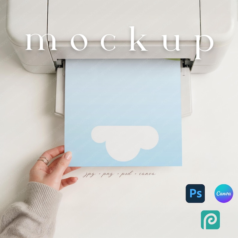 May include: A light blue paper with a white cloud design is being printed from a white printer. The word "mockup" is printed at the top. The bottom of the paper has the text "jpg . png . psd . canva".