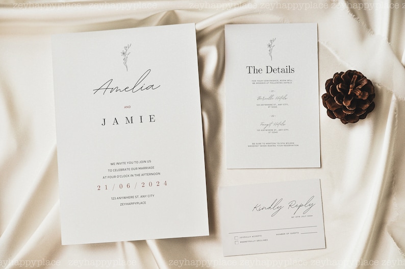 May include: A wedding invitation suite with a minimalist design. The main invitation features a simple floral illustration and the names Amelia and Jamie. The details card includes the date, time, and location of the wedding. The RSVP card has a simple "Kindly Reply" message.