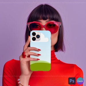 Op de afbeelding: Een blauwe en witte telefoonhoes met een wit wolkontwerp en een groene grasheuvel aan de onderkant. De hoes is ontworpen voor een iPhone.