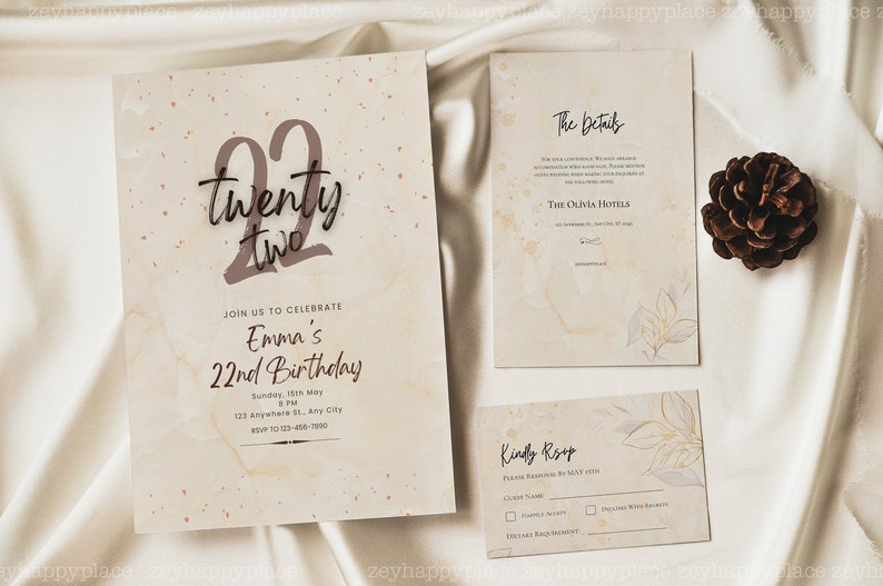 May include: A beige invitation card with a brown marble texture and gold flecks. The number 22 is written in brown with the words "twenty two" below it. The text "Join us to celebrate Emma's 22nd Birthday" is written in brown. The date, time, and location are listed below. The invitation is for a birthday party.