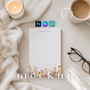 May include: A rectangular notepad with horizontal lines and the text ZEYHAPPYPLACE at the top. The bottom border features a colorful watercolor illustration of various wildflowers in shades of pink, yellow, and green on a white background.