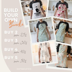 May include: Build your own apron bundle with a variety of designs, including a white apron with a black graphic, a green and white gingham apron, a pink apron with red apples, a green floral apron, a beige apron with a grapevine design, and a peach and green floral apron.  Buy 2, save 25%, buy 3, save 30%, buy 4, save 40%, buy 5, save 50%.