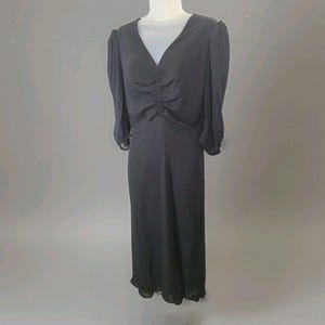 May include: A set of three ceramic mugs with a speckled, matte finish. The mugs are in shades of cream, light brown, and dark brown. Each mug has a simple, minimalist design and a rounded handle.