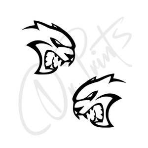 May include: Two black and white decals of a snarling, stylised animal head. The animal has a pointed snout, sharp teeth, and a fierce expression.