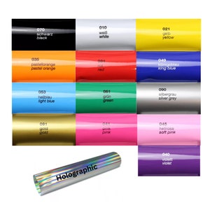 May include: A chart of 12 color swatches with corresponding numbers and names in German and English. The colors include black, white, yellow, orange, red, blue, light blue, green, silver grey, gold, pink, and soft pink. The chart also includes a holographic sticker.