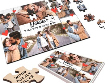 May include: A wooden jigsaw puzzle with a collage of photos of a couple. The puzzle is in a white box with the text "Natalie Will You Marry Me?" printed on it. The puzzle pieces are scattered around the box.