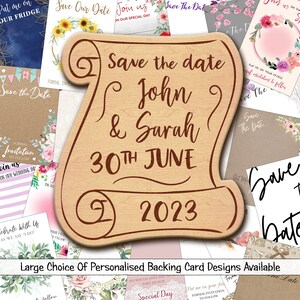 May include: A wooden scroll-shaped save the date announcement with the text "Save the date John & Sarah 30th June 2023". The scroll is surrounded by various save the date cards with floral designs.