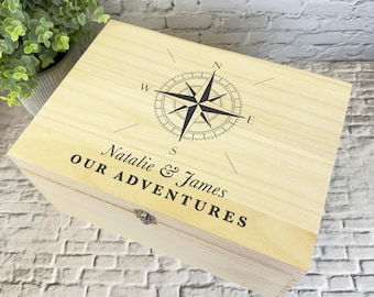 May include: A wooden box with a compass design and the text "Natalie & James Our Adventures" engraved on the lid.