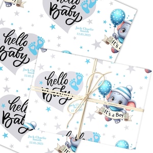 May include: White wrapping paper with a repeating pattern of blue stars and baby footprints. The words "hello Baby" are in a heart shape, with the text "It's a Boy" on a banner held by a cartoon elephant. The name "Jack Charlie Smith" and the date "12.05.2025" are also visible.