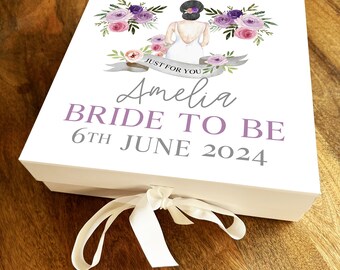 Pode incluir: Caixa de presente branca com um design floral roxo e rosa e o texto "Just for you" acima do nome "Amelia Bride to Be 6th June 2024".