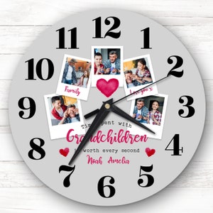 May include: A gray round clock with black numbers and hands. The clock has a collage of photos of a family with the text "Time spent with Grandchildren is worth every second Noah Amelia".