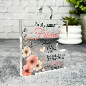 May include: A clear acrylic jigsaw piece with a floral design and the text "To My Amazing Friend Thank You For Being Such An Important Piece Of My Life".