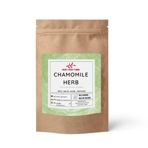 May include: A brown paper bag of chamomile herb with a green label. The label reads "Chamomile Herb" and includes the text "100% Dried Herb, Crushed". The bag is sealed and ready for use.