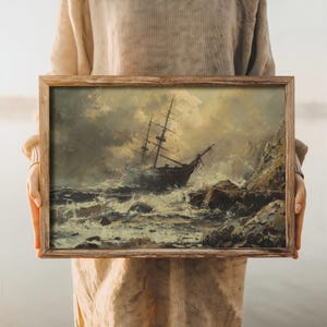 Rustic home decor ocean wall art, depicting a historic shipwreck scene with dynamic skies and rough waters.