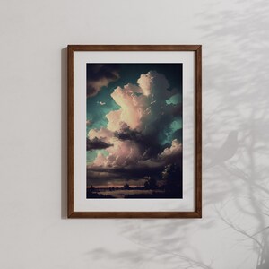 May include: A framed print of a landscape with a large, fluffy, pink and white cloud in a blue and green sky. The cloud is casting a shadow on the ground below.