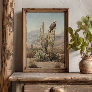 Wild west painting with a vulture on a saguaro cactus, showcasing vintage desert flora and western decor style.